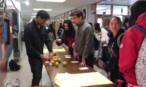 Junior Tarun Prabhala gives out healthy breakfast options for students as a part of Active Mind's Stress Less, Laugh More week.