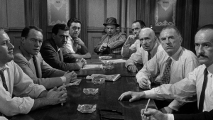 "12 Angry Men," a movie directed by Sydney Lumet showcases the complexities of the justice system in the 1950's through a seemingly "shut and dry" case