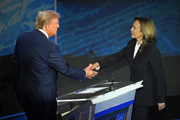 Harris and Trump shake hands following the previous debate, where Biden and Trump did not acknowledge one another prior to the debate. 