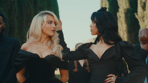 Sabrina Carpenter and Jenna Ortega come face to face at Carpenter’s ex-boyfriend’s funeral in Carpenter’s music video “Taste.”