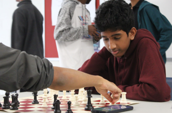 Freshman Adhiraiyan Ayyappan plays senior Arnav Gupta in the final round of the Homecoming chess tournament on Wednesday, Sept. 25. “I expected to lose first,” Ayyappan said.