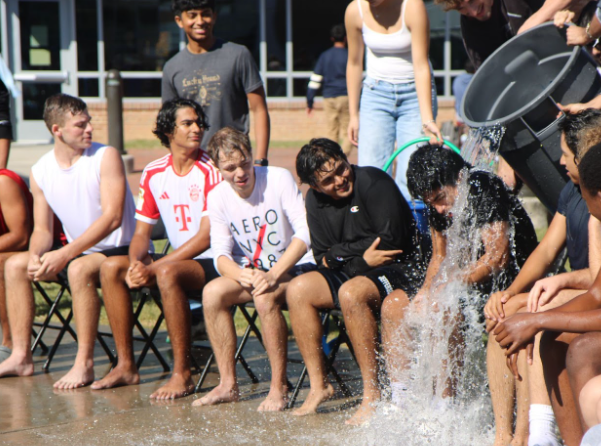 On Oct. 24, a bucket of water drenches senior Darwin Lopez-Campos during the Soak a Senior event in Nobel Courtyard. “People pretend to not wanna get wet but it’s fun for everyone and something different to change up the flow a bit,” Lopez-Campos said.