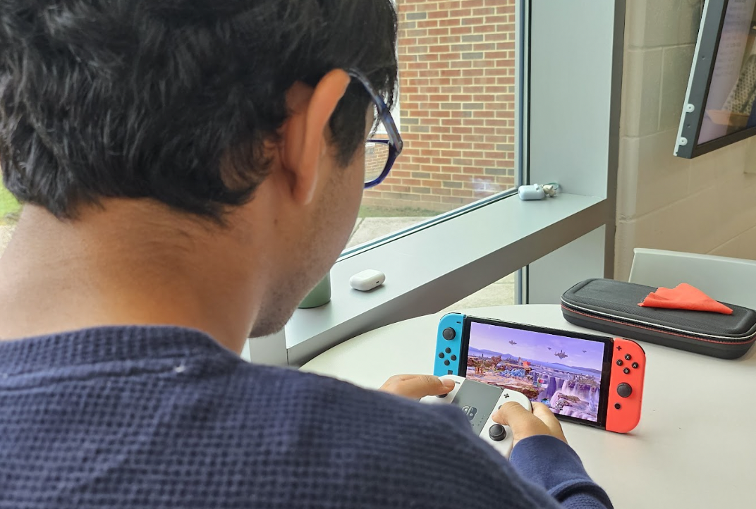 Playing "Super Smash Bros Ultimate," junior Neil Ramarapu reflects on the homecoming video game tournament. "I think it’s about competition, but you can get a lot more than just homecoming points from it.”