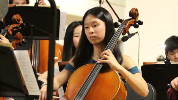 Junior Valerie Lai performs during the Viennese Ball. “It's basically an orchestra-held Homecoming,” orchestra co-president Spencer Wang said. “[But] we’re the ones providing the music, and we objectively have better food.”