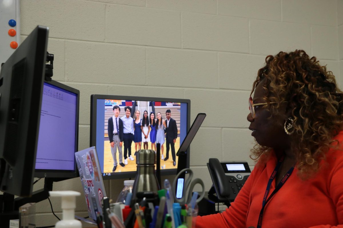 Getting ready for Veterans Day, Assistant Principal Volita Russell sits at her computer as the new grade level administrator for the senior Class of 2025. "I was working with the seniors in the absence of Mr. Frank, and so it wasn't a major adjustment." 