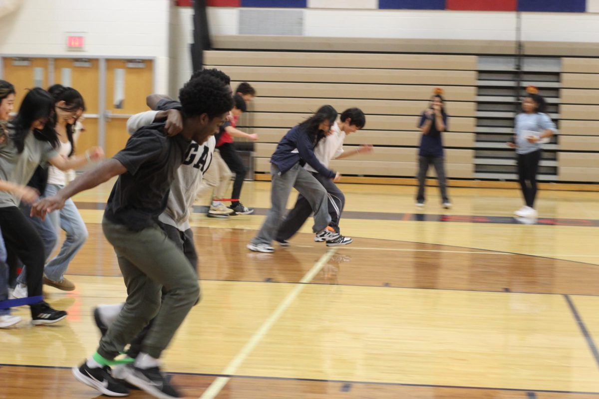 Students compete in the three-legged race. “Hopefully [the Turkey Games] become a tradition,” 2026 Class Council President Justin Kim said. “Community building is always great.”