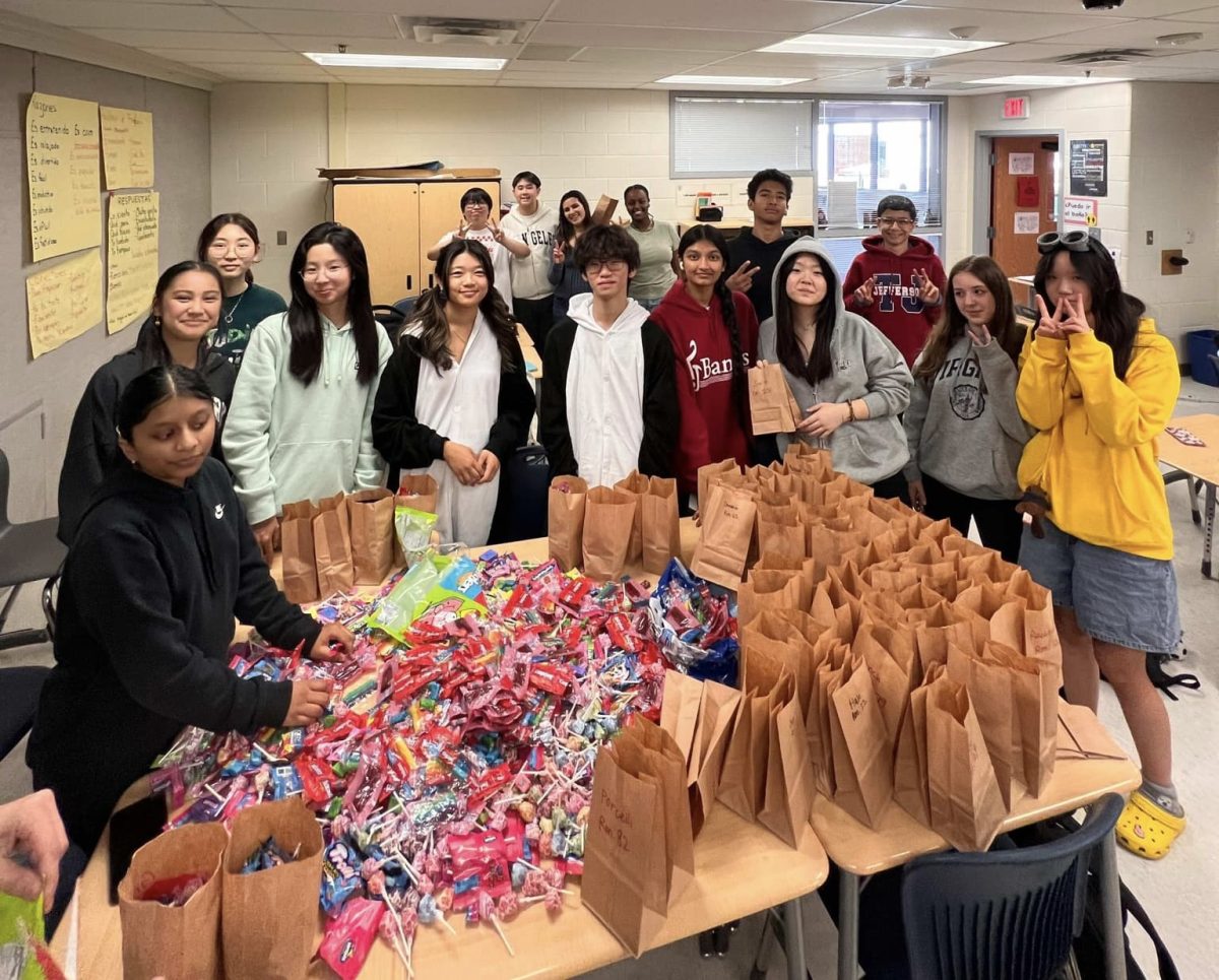 SGA members prepare Teach-or-Treat candy bags to distribute to teachers. “ Many Students didn't just want candy,” English teacher Lona Klein said. “They wanted more riddles [because the riddles] weren’t hard enough.”