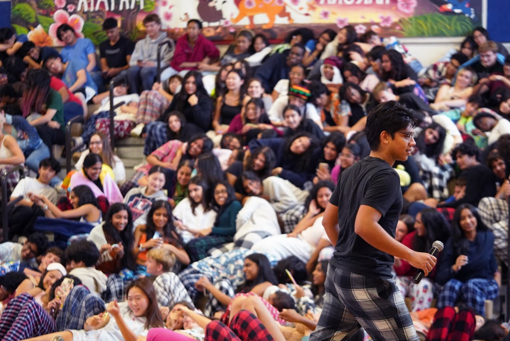 Narrating a skit for the pep rally on Thursday, Sept. 26, senior class president Akul Dixit tells the story of “sleepy seniors.” “I think this was our worst pep rally,” Dixit said. “We came into this under the impression that we could turn off lights, but minutes before this roll call, we were told we couldn't. It didn't go well.”