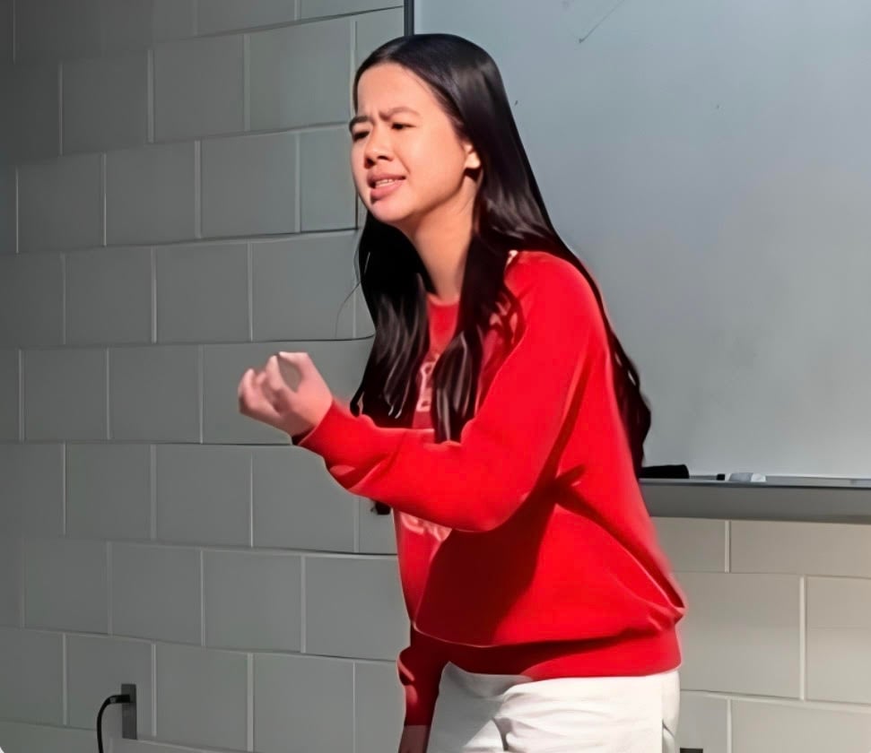 Sophomore Ami Le recites a poem in the school-wide Poetry Out Loud competition on Friday, Dec. 13. "Poetry Out Loud invites you to have an emotional relationship with a poem,” English teacher and co-sponsor Rebecca Walz said. “It’s a small, possibly scary, thing you can do to grow and try something new, and it will definitely be a fun experience."