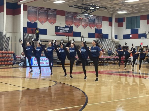 The Jefferson dance team performs between the third and fourth quarter of the varsity girls basketball game. “A lot of the time, the captains choreograph a dance for us to practice during [practices] and at home,” junior Holly Huang said.