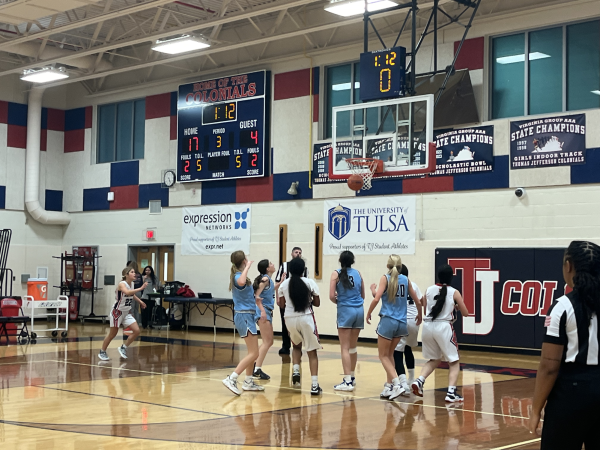 Freshman Jackie Pritchard shoots the ball as both teams watch anxiously. “I think we did pretty well, we pressed really well and we also took lots of shots.” freshman Jackie Pritchard said.