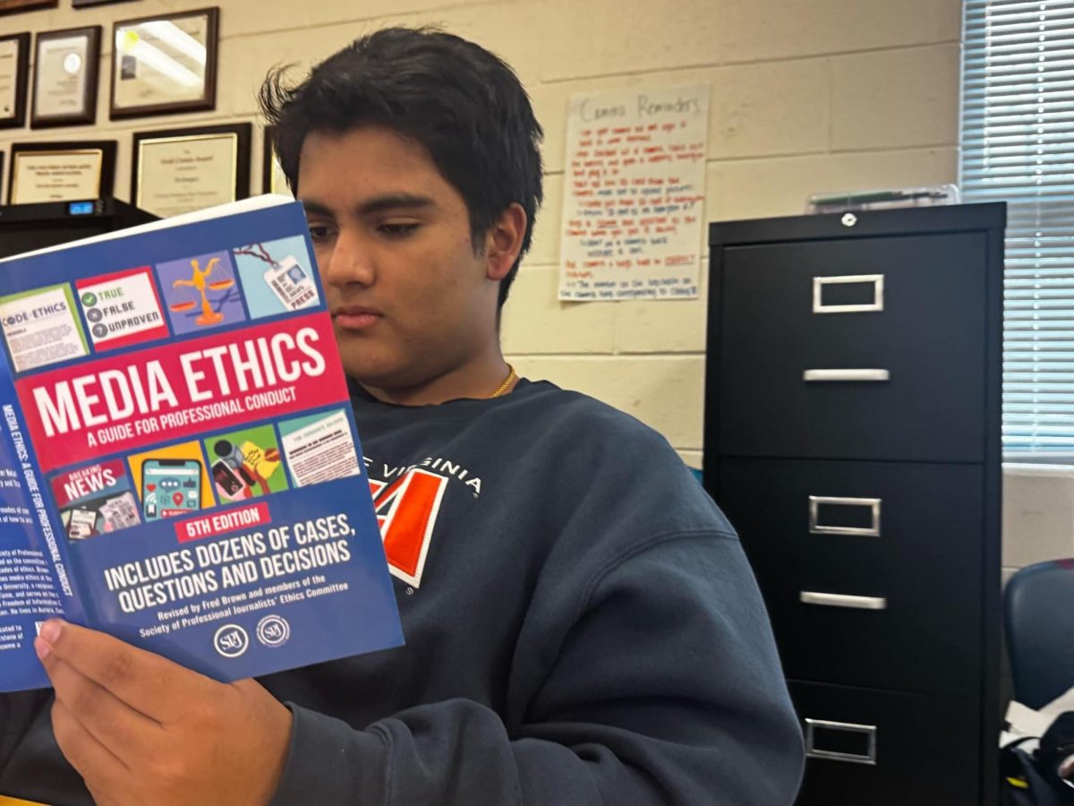 Reading a book, sophomore Shriram Navale learns about media ethics. “Freedom of speech is very important to me especially because I have a lot to say,” Navale said.