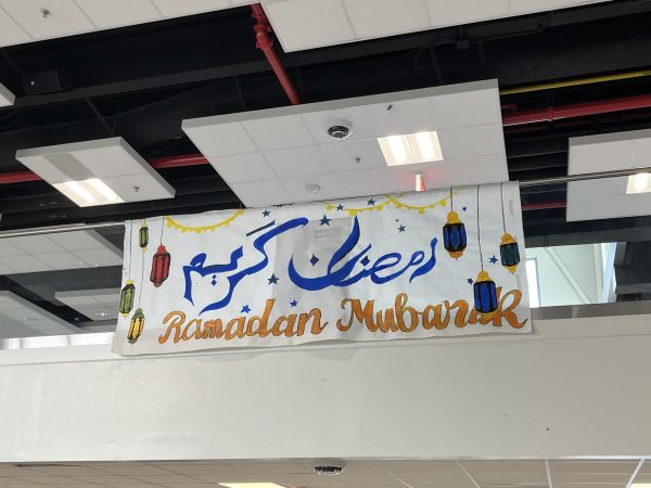 Muslim Student Association paints and hangs up a banner in Nobel Commons to celebrate the beginning of Ramadan. 
