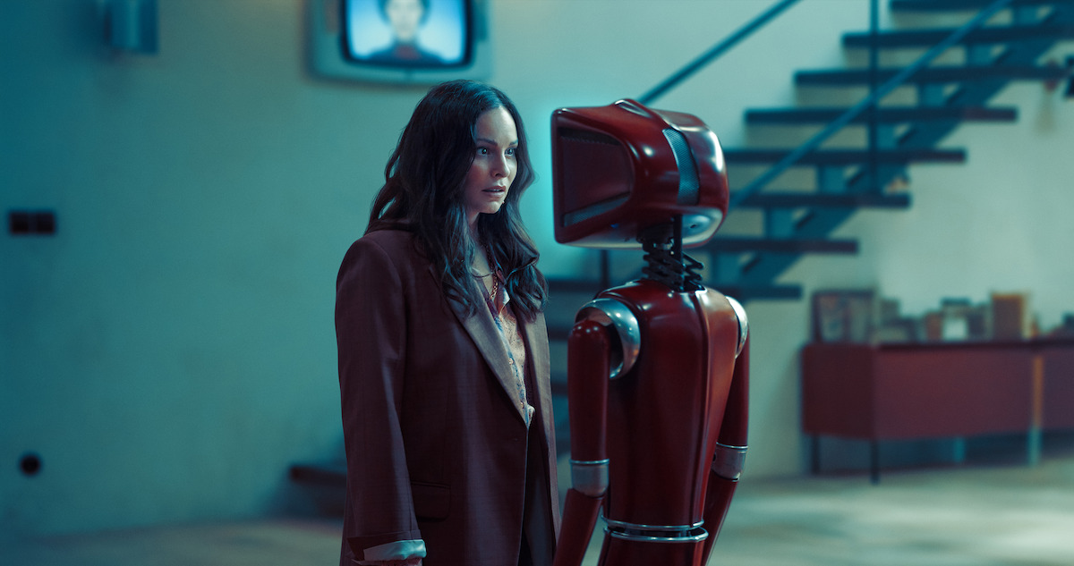 The mother of the Prill Family, Samira (Mina Tander), stares directly into the thriller’s main antagonist, the creepy AI robot, Cassandra (Lavinia Wilson).